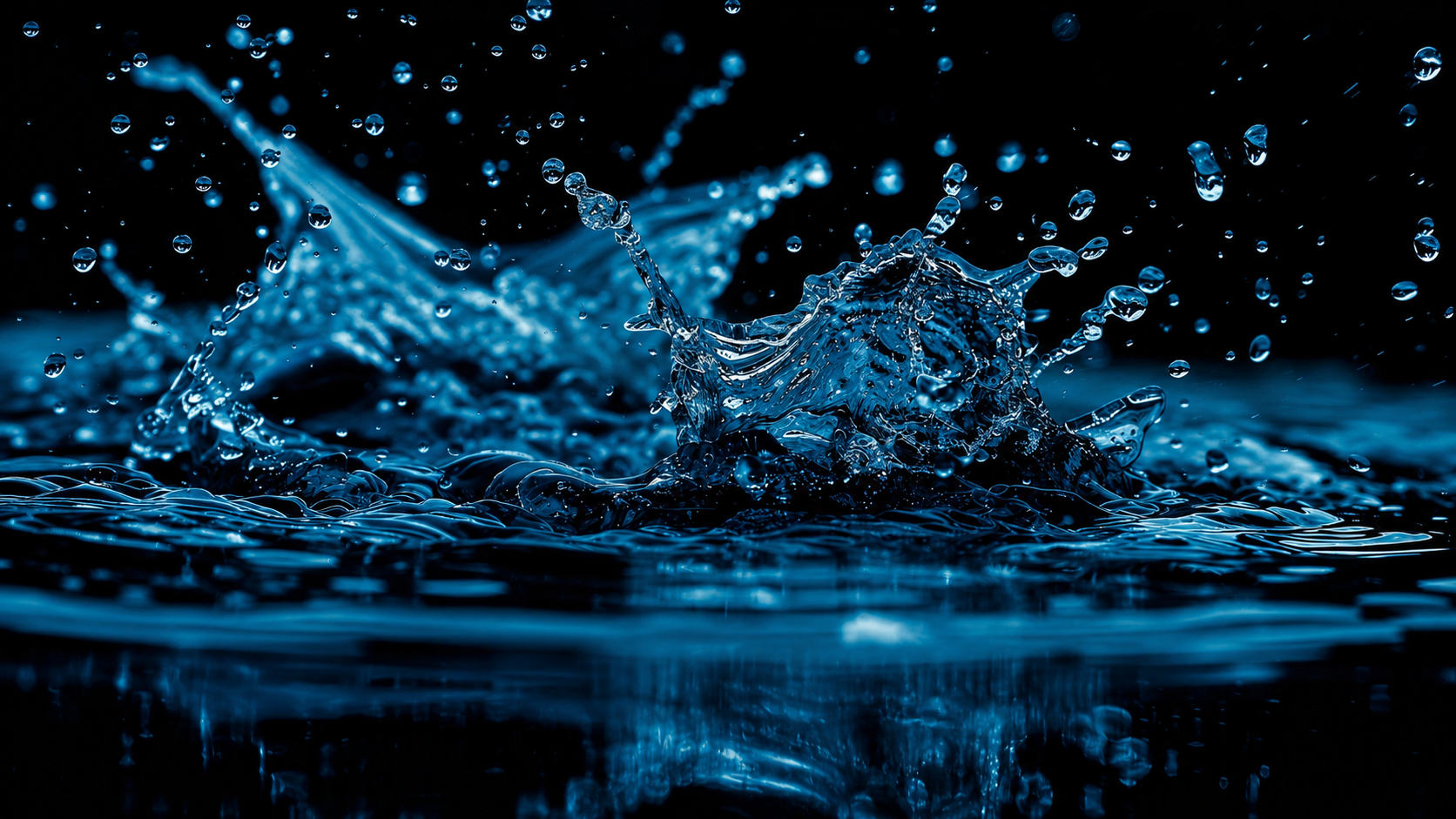 Blue water splashing against a dark background